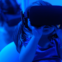 A very young girl using a VR device.