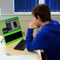 A boy using Tech Jam equipment.