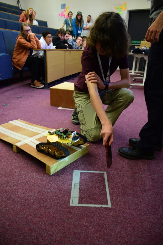 Mission to Mars, student using a mobile phone torch to automatically guide their rover