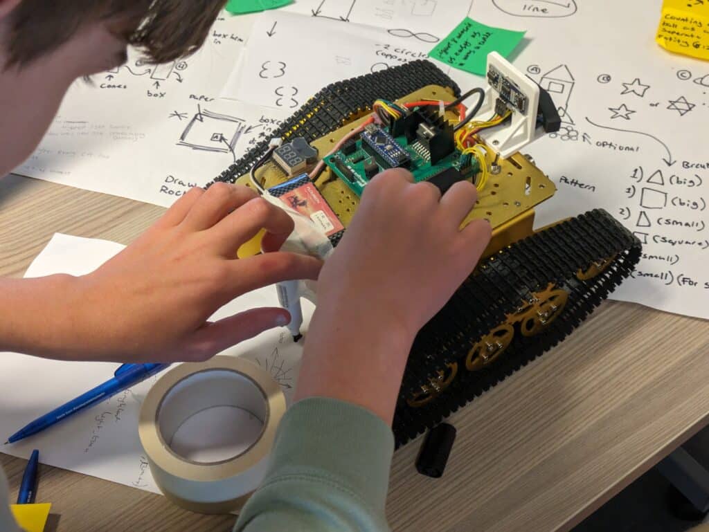 Mission to Mars, student adjusting the rover prior to testing their code